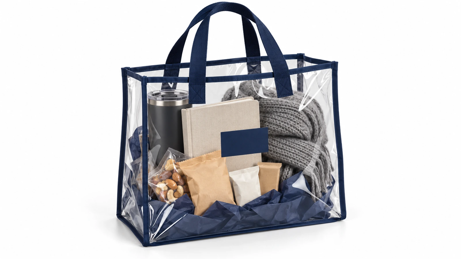 Sac cabas en PVC transparent à liseré bleu marine contenant un kit cadeau d'entreprise composé d'un gobelet de voyage, d'un carnet, d'en-cas et d'une écharpe pliée, le tout visible à travers le sac