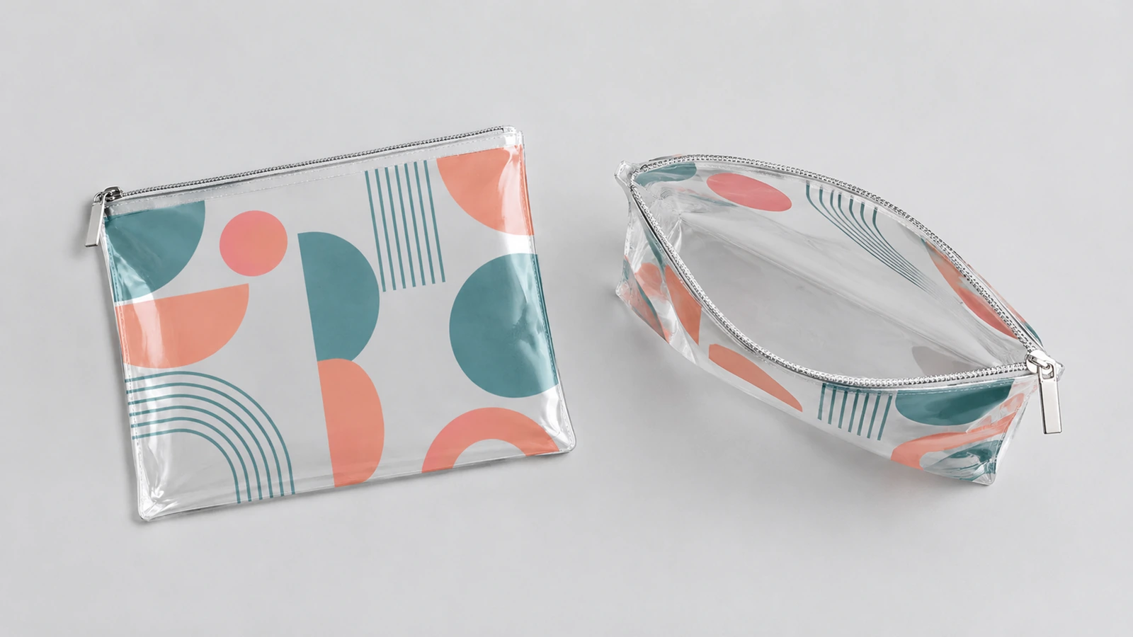 Pochettes transparentes à fermeture éclair fermées et ouvertes, à impression géométrique corail et sarcelle